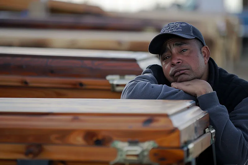 A worker grieves a fallen worker in Los Angeles