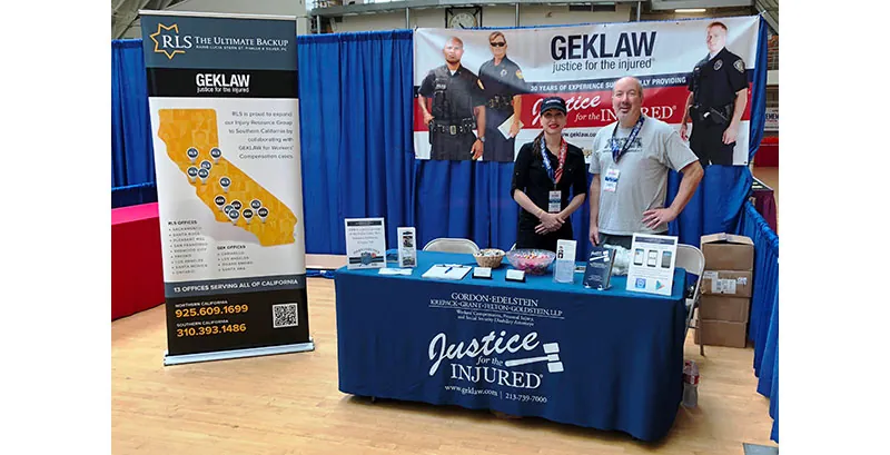 Erika Vargas and paralegal Ron Christensen at the LA Run to Remember Expo.