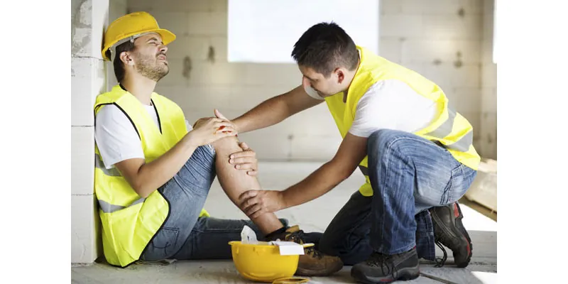 Worker with leg injuries, hurt at work.